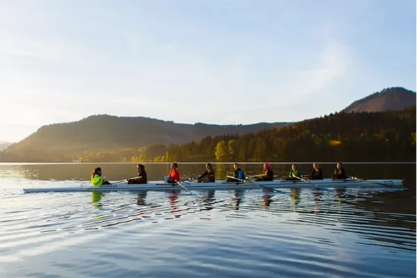 Women's crew team rowing on Dexter Lake